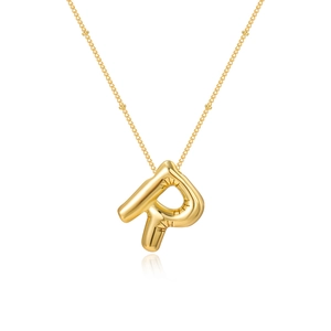 Detail of gold bubble letter R pendant featuring realistic 3D inflated balloon texture
