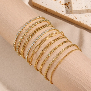 Detailed set of eight gold plated chains featuring zircon tennis and Cuban link designs