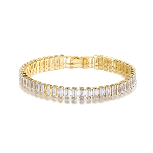Close-up of gold-plated bracelet featuring baguette-cut zircon stones and folding clasp