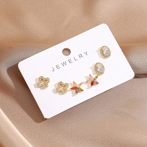 Detailed set of 16K gold plated stud earrings featuring clover and colorful crystal designs