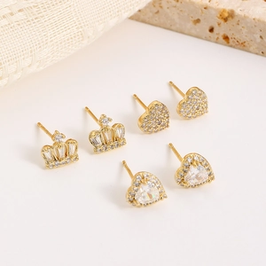 Detailed view of 16K gold plated crown and heart stud earrings set with zircon stones