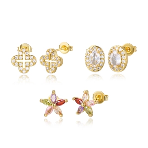 Three-pair 16K gold plated stud earrings set with colorful gemstones on white background