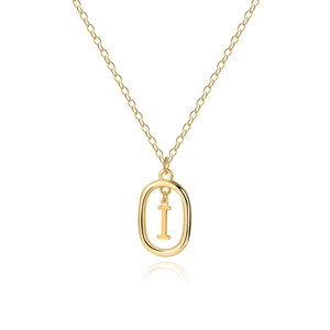 Macro shot of 18K gold letter I pendant with oval frame on a delicate cable chain