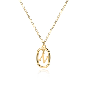 Detailed view of an 18K gold letter N pendant with an oval frame on a delicate chain