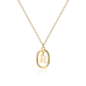 Macro view of gold plated 18K initial R oval pendant with polished delicate chain