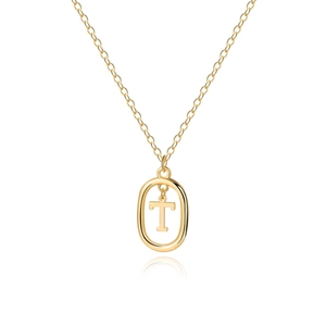 Detail of golden chain with oval pendant featuring a capital letter T in metal finish