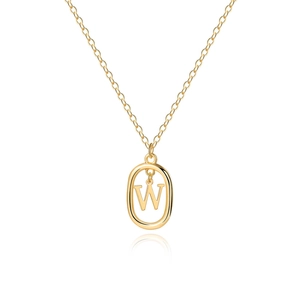 Detail of golden oval pendant necklace with polished letter W on delicate chain
