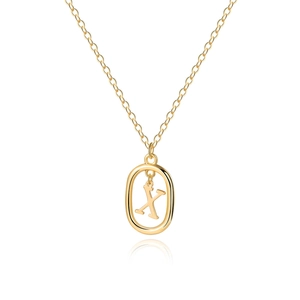 Detail of minimalist gold chain with oval pendant featuring the metal letter X engraving