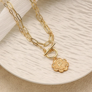 Double-layer golden OT buckle necklace with clover pendant featuring embossed letter P