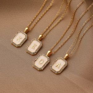 Gold rectangular alphabet shell necklace with shimmering zircon borders for women