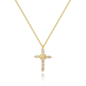Macro detail of the 18k gold cross necklace with sparkling pave cubic zirconia stones
