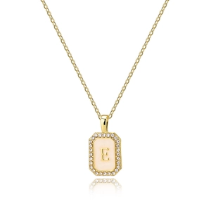 Close-up of gold rectangle pendant with shell inlay, zircon border and letter E detail