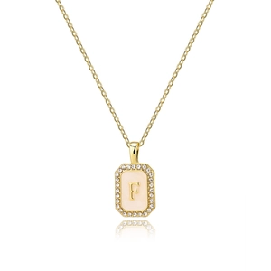 Close-up of gold square shell pendant with letter F and pavé zircon border details
