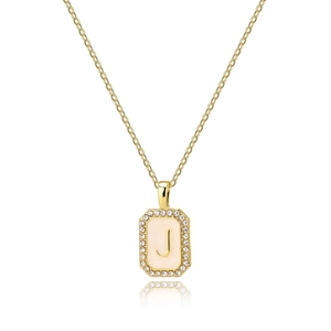Close-up of golden letter J shell pendant with sparkling zircon and rectangle frame