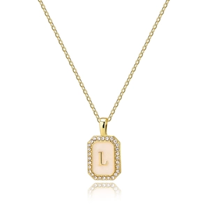 Detailed view of golden rectangle pendant with shell inlay letter L and zircon border