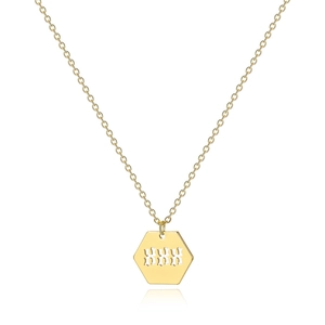 Macro detail of gold-plated hexagonal pendant featuring hollow 888 angel number engraving