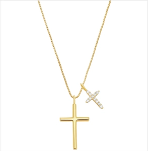 Detailed macro view of 18k gold box chain with dual cross pendants and white zircons