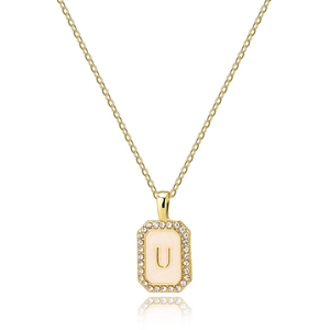 Detailed close-up of golden rectangular letter U pendant with pink shell and zircons