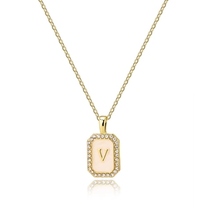 Detail of square gold shell pendant with zircon border and letter V on fine chain necklace