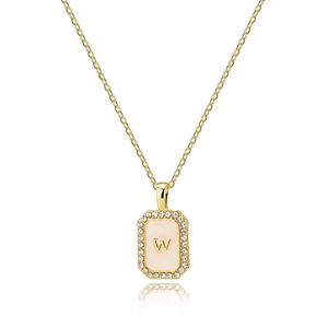 Detailed close-up of a gold octagon pendant necklace with shell letter W and crystals