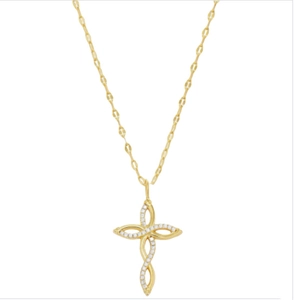 Detail of a 18k gold cross pendant necklace with sparkling diamonds and gucci link chain
