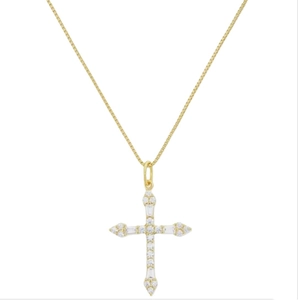 Macro shot of 18k gold cross pendant with cubic zirconia inlay and fine box chain
