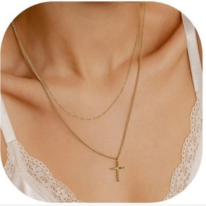 Elegant 18K gold-plated double-layer cross pendant necklace shown on a female model