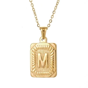 Golden square letter M pendant necklace with sunburst texture on slim chain