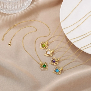 Detail view of heart-shaped 18K gold-plated necklaces with colorful zirconia stones