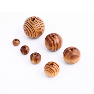Natural pine wood beads with striped texture and center holes for DIY crafts