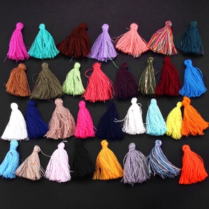 Selection of 28 colorful handmade cotton tassels for DIY jewelry and bookmark crafts