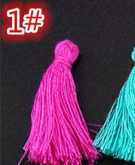 Detailed macro view of vibrant rose red craft tassel with hand-wound decorative knot