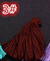Detailed close-up of dark reddish brown silk tassel pendant with binding for DIY crafts