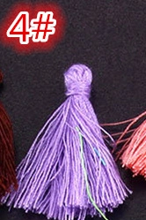 Detail of high-gloss purple silk tassel with secure top wrap for DIY crafts