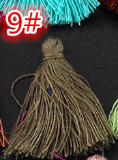 Close-up of handmade deep brown decorative tassel with top loop for DIY crafts
