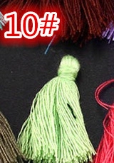 Detail of light green cotton tassel pendant with reinforced knot for DIY crafts