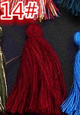 Detail of dark red cotton tassel pendant for DIY jewelry and bookmark crafts