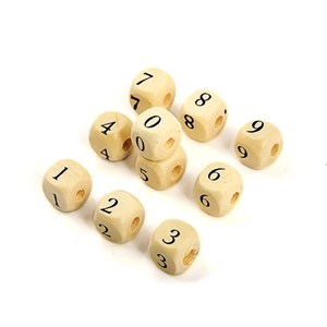 Macro shot of square wooden beads with black numbers 0-9 and vertical holes for DIY crafts
