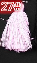 Detail view of pink silk decorative tassel with hanging loop for DIY crafts and bookmarks