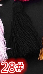 Close-up of black cotton handmade tassel pendant for DIY bookmarks and accessories