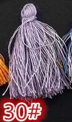 Detailed macro shot of light purple silk tassel pendant with spherical head and SKU 30# tag