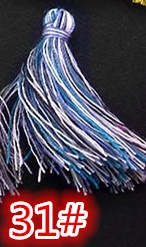 Macro detail of mixed blue and white silk craft tassels with item number 31 label