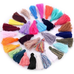 Macro shot of colorful handmade tassels with loop cords for DIY craft and bookmark decoration