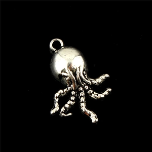 Macro detail of octopus pendant with antique silver finish and lifelike tentacle textures