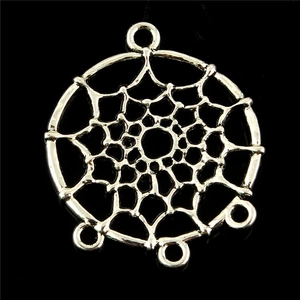 Macro view of a round silver alloy dreamcatcher connector for DIY jewelry projects