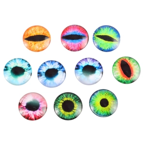 Macro view of ten round glass dragon eye cabochons with vibrant colors and gloss