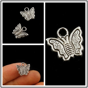 Colgante de mariposa plateado antiguo con relieve para creación de joyería DIY