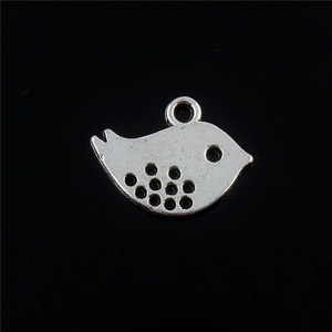 Retro silver alloy peace bird pendant with hollow wing design on a black background