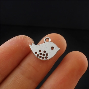 Antique silver peace dove pendant with dot cut-out design and bail for necklace