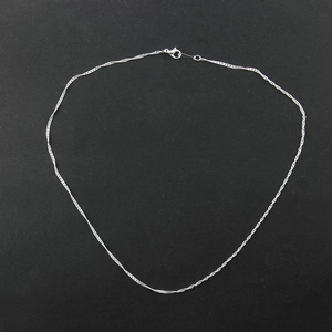 Polished silver water wave chain necklace with secure lobster clasp on black background